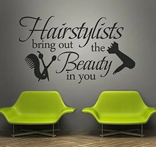 Salon wall with script lettering and scissors graphic above green chairs